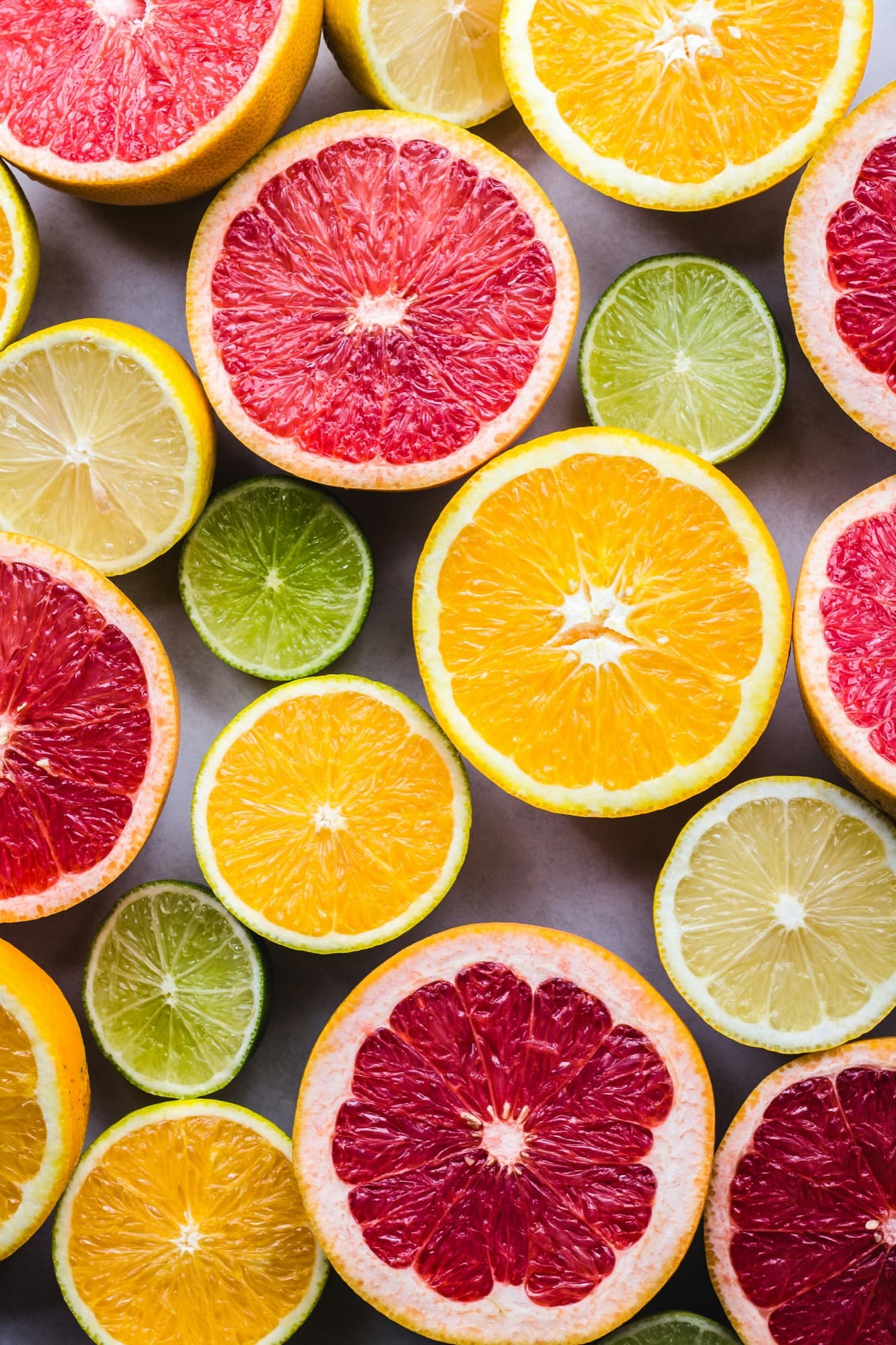 Sliced citrus fruit in vivid colors, arranged overhead
